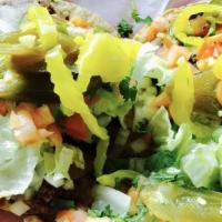 3 Enchiladas · Corn tortillas with meat or cheese smothered in red or green salsa and melted cheese. Includ...