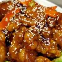 Sesame Chicken · Spicy. Breaded chicken stir-fried in a plum sauce, topped with sesame seeds. Served on top o...