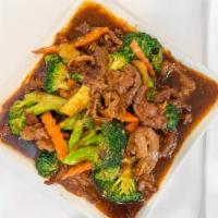 Beef With Broccoli · Sliced beef stir-fried in a brown sauce with broccoli, water chestnut and carrot.