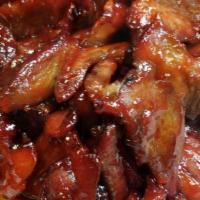 B.B.Q. Pork · Sliced pieces of pork marinated in a sweet red B.B.Q. sauce.