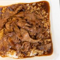 Tender Beef & Gravy On Rice · Sliced beef stir-fried in a brown garlic sauce over the steamed rice. No vegetable.