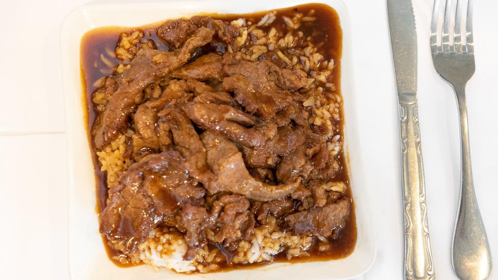 Tender Beef & Gravy On Rice · Sliced beef stir-fried in a brown garlic sauce over the steamed rice. No vegetable.