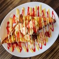 Stuffed French Toast  · Two pieces of our signature French toast stuffed with sweet mascarpone and cream cheese fill...