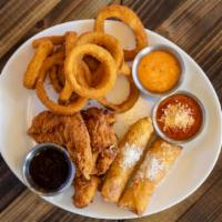 Sampler Platter · A delicious combo of Onion Rings, Chicken Tenders, and Mozzarella sticks. Served with marina...