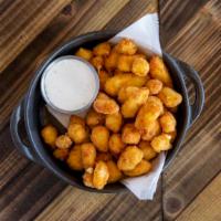 Cheese Curds · Lightly Breaded white cheddar Cheese Curds served with homemade buttermilk ranch