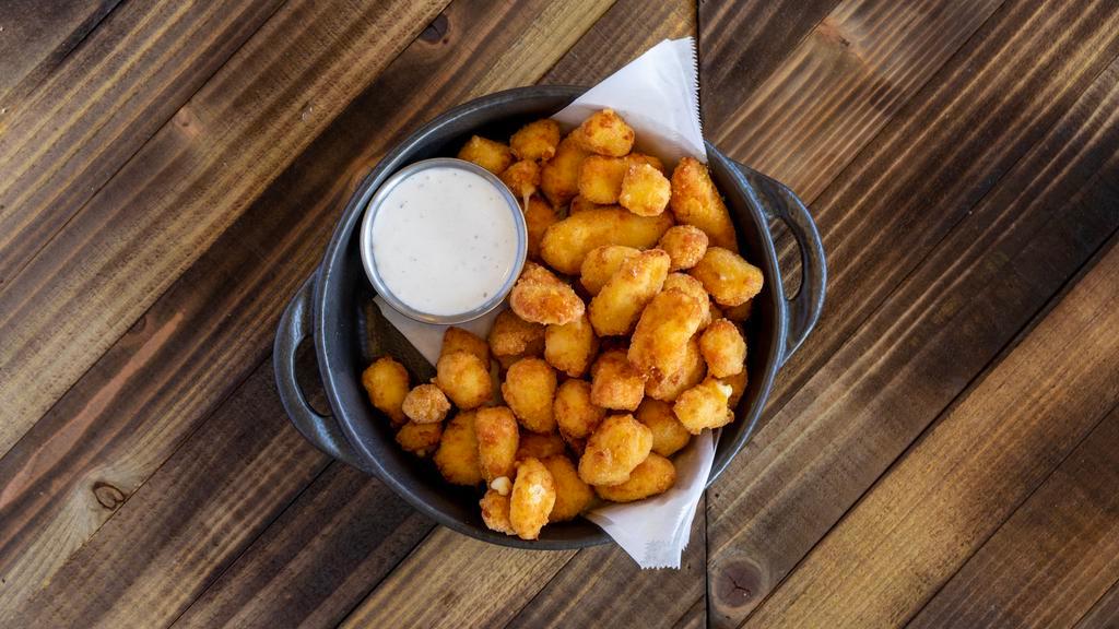 Cheese Curds · Lightly Breaded white cheddar Cheese Curds served with homemade buttermilk ranch