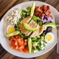 Cobb Salad · Fresh mixed greens, broiled strips of chicken, chopped bacon, aged blue cheese crumbles, sli...