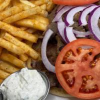 Gyro Sandwich · Gyros sliced thin from the spit in grilled pita with red onions, tomatoes, and homemade tzat...