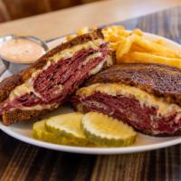 Rueben New Yorker · Lean Corned Beef, Swiss Cheese, Sauerkraut and served on Grilled Marble Rye with a side of T...