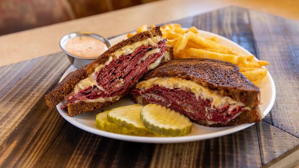Rueben New Yorker · Lean Corned Beef, Swiss Cheese, Sauerkraut and served on Grilled Marble Rye with a side of Thousand Island Dressing.