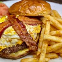*Hangover Burger · Topped with bacon, american cheese, a fried egg, and caramelized onions, lettuce, tomato and...