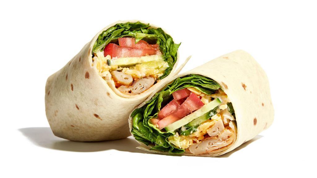 Buffalo Chick'N Wrap · Grilled chick’n, romaine, pepperoncini, cucumber, tomato, cheddar, ranch, buffalo sauce
