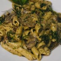 Mushroom Pesto Penne · Penne noodles, mushrooms, sun-dried tomatoes, pesto cream sauce, fresh basil.