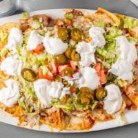 Silver Lake Nachos · Chips, refried beans, melted Chihuahua cheese, lettuce, pico de gallo, sour cream and guacam...