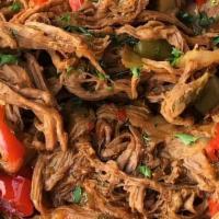 Ropa Vieja · Slow roasted shredded certified angus beef, onion, bell pepper, garlic, olivas and creole sa...