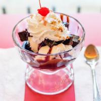 Brownie Sundae · 2 scoops of premium ice cream, topped with a chocolate brownie and smother with rich chocola...