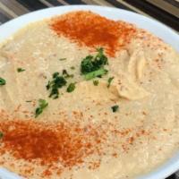 Spicy Hummus · Spicy. Creamy mashed garbanzo beans with garlic, lemon juice, tahini, and hot pepper.