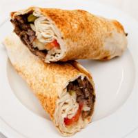 Beef Shawarma  · Tomato, onion, pickles, tahini sauce wrapped in pita bread
