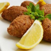 Fried Kibbe  · finely ground seasoned beef mixed with cracked wheat and fried to golden brown