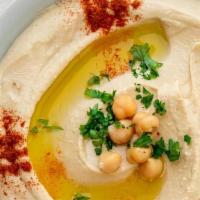 Large Hummus  · A smooth blend of chickpeas and tahini sauce mixed with lemon and garlic