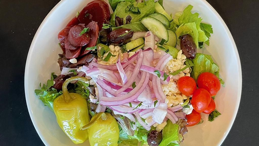 Greek  · Romaine lettuce, feta, cucumber, cherry tomato, kalamata olive, red onion and fresh dill, beets and pepperoncini served with Greek dressing