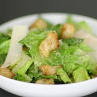 Caesar  · Romaine lettuce, parmesan cheese, croutons served with Caesar dressing