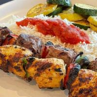Duo Kabob · One skewer of chicken and one skewer of beef kabob, grilled served with rice and grilled veg...