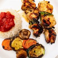 Chicken Kabob  · marinated grilled cubes of chicken breast served with rice and grilled vegetables