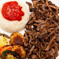 Beef Shawarma  · Thinly sliced beef marinated and grilled. Served with rice and grilled vegetables