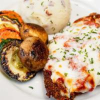 Chicken Parmesan · Breaded chicken breast topped with marinara sauce and mozzarella cheese. Served with mashed ...