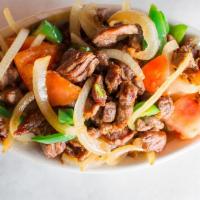 Beef Tibs · Spicy. Tender tip pieces of marinated rib eye beef cooked with peppers, onions, garlic , tom...