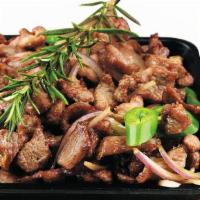 Zilzil Tibsi · Strips of tender beef grilled with onion, jalapenos, marinated with butter and house-made sp...