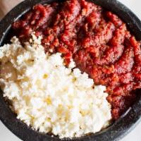 Kitfo · Spicy. Ground beef with homemade spiced butter and ground chili powder. Served with injera a...
