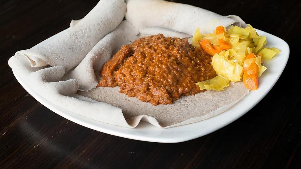 Birsin (Misir) · Split lentils, onion, garlic, ginger and house -made spices served with Enjera.