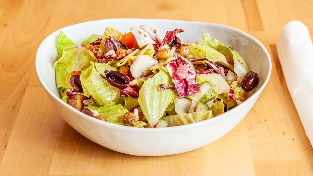 The Modern Greek Salad · Lettuce, radicchio, red onion, cucumber, cherry tomatoes, spiced chickpeas, feta oregano feta vinaigrette.