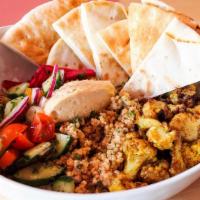 Veggie Bowl · cauliflower shawarma, warm pita, hummos, Persian salad, beet pickles atop quinoa tabouli. Th...