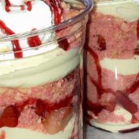 Cheesecake Cups · Includes cheesecake, fresh strawberries and one topping. Pictured: Strawberry Crunch Flavor