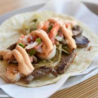 Surf & Turf · Seared shrimp, tri tip steak, blistered onions/poblanos, tomato pico, and chipotle queso. (5...