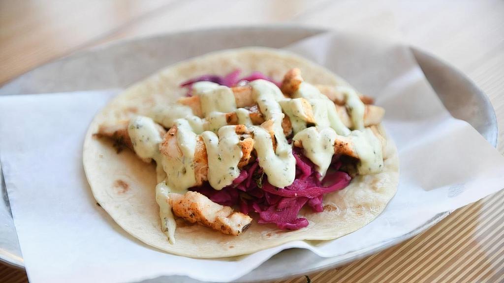 Cali · Seared chile spiked Regal Springs tilapia with creamy avocado-cilantro sauce, pickled red cabbage slaw. (219)