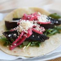 Ma-La Bello · Sichuan blistered portobello mushrooms with baby arugula, sweet pickled red onions, kale pes...