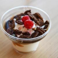 Turtle · Creamy vanilla custard topped with rich hot fudge, caramel and roasted pecans.