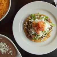 Tostada · 1 flat  tortillas prepared with a base of refried beans and your choice of meat. Garnished w...