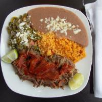 Barbacoa De Res Dinner · Steamed beef cooked to perfection marinated our secret adobo sauce. Served with a cactus sal...