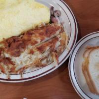 Oakland Diner Omelette · Filled with fresh mushrooms, onions, green peppers, bacon, sausage and ham, and smothered wi...
