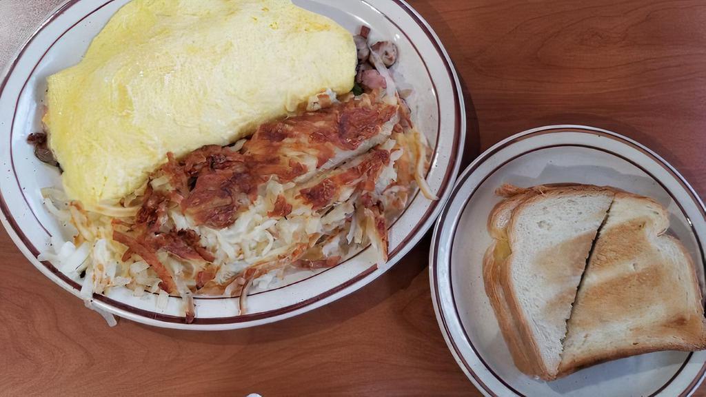 Oakland Diner Omelette · Filled with fresh mushrooms, onions, green peppers, bacon, sausage and ham, and smothered with American cheese