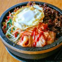 Korean Stone Bowl Rice · Hot. White rice cooked  in a stone bowl, topped with thinly sliced beef, kimchi, bean sprout...
