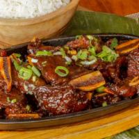 Korean Barbecue Short Ribs · Served with steamed rice. Brown or fried rice with an extra charge