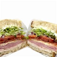 Single Stack Club · Turkey, ham, bacon, lettuce, tomato, onion, provolone, and mayo on sourdough bread.