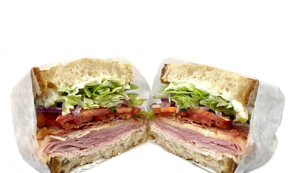 Single Stack Club · Turkey, ham, bacon, lettuce, tomato, onion, provolone, and mayo on sourdough bread.