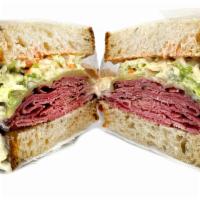 Pastrami Reuben · Pastrami, coleslaw, swiss cheese, and Russian dressing on rye bread.